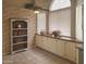 Bright breakfast nook with brick accents and window seating for enjoying the view at 1734 E Commonwealth Cir, Chandler, AZ 85225