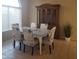 Dining room with blue chairs, wooden table and a large china cabinet at 1734 E Commonwealth Cir, Chandler, AZ 85225