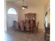 Formal dining room with a ceiling fan, tile floors and a hutch with glass display case at 1734 E Commonwealth Cir, Chandler, AZ 85225