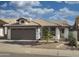 Charming single-story home with a tile roof and a well-maintained front yard at 1734 E Commonwealth Cir, Chandler, AZ 85225