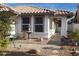 Charming front yard featuring a stone fountain, desert landscaping, and a covered entrance at 1734 E Commonwealth Cir, Chandler, AZ 85225