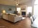 Cozy living room showcasing a fireplace, neutral color palette, and hardwood floors at 1734 E Commonwealth Cir, Chandler, AZ 85225