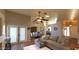 Open-concept living area with access to dining room, stylish furniture, and plenty of natural light at 1734 E Commonwealth Cir, Chandler, AZ 85225