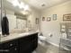 Bathroom with a large mirror, neutral-colored walls, and modern fixtures at 17850 N 68Th St # 2160, Phoenix, AZ 85054