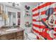 Cheerful bathroom featuring a Mickey Mouse-themed shower curtain and decor, adding a playful touch at 19061 N 5Th Ave, Phoenix, AZ 85027