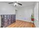 Bedroom featuring hardwood floors, neutral paint, shuttered windows, and ample closet space at 19061 N 5Th Ave, Phoenix, AZ 85027