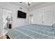 Bright bedroom with ensuite bathroom featuring neutral walls and a flat-screen TV for entertainment at 19061 N 5Th Ave, Phoenix, AZ 85027