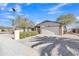 Charming single-story home with a desert landscape, palm tree, and a two-car garage at 19061 N 5Th Ave, Phoenix, AZ 85027