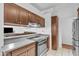 Modern kitchen showcasing stainless steel appliances, ample cabinet space, and a breakfast bar at 19061 N 5Th Ave, Phoenix, AZ 85027