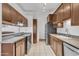 Functional kitchen featuring stainless steel appliances, ample cabinet space, and tiled floors at 19061 N 5Th Ave, Phoenix, AZ 85027