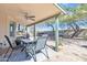 Inviting covered patio with ceiling fan offers a relaxing outdoor space with brick pavers and direct access to the backyard at 19061 N 5Th Ave, Phoenix, AZ 85027