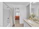 Bright bathroom features a granite countertop, white cabinetry, and a shower-tub combo at 197 E Douglas Ave, Coolidge, AZ 85128