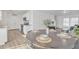 Open concept dining area flowing to the kitchen, offering a seamless transition for entertaining guests at 197 E Douglas Ave, Coolidge, AZ 85128