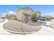 Charming two-story home featuring a well-maintained, low-water, rock landscape and a welcoming facade at 197 E Douglas Ave, Coolidge, AZ 85128