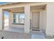 Inviting front porch with a 'Welcome' mat and a decorative 'HOME' sign, offering a cozy entrance at 197 E Douglas Ave, Coolidge, AZ 85128