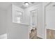 Upstairs hallway showcasing wood floors leading to the bedroom and bathroom at 197 E Douglas Ave, Coolidge, AZ 85128