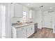 Modern kitchen featuring white cabinetry, granite countertops, and stainless steel appliances at 197 E Douglas Ave, Coolidge, AZ 85128