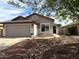 Charming single-story home with a two-car garage, desert landscaping, and a welcoming entrance at 20315 N 82Nd Ln, Peoria, AZ 85382