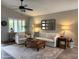 Cozy living room with plush seating, a ceiling fan, and a decorative mirror over a sofa at 20315 N 82Nd Ln, Peoria, AZ 85382