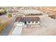 An aerial view highlights the spacious layout, horse facilities, and ample land surrounding the home at 20438 W Carver Rd, Buckeye, AZ 85326