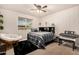 Comfortable bedroom with a ceiling fan and a comfortable papasan chair at 20438 W Carver Rd, Buckeye, AZ 85326