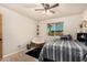 Bedroom with neutral walls, a ceiling fan, and a papasan chair at 20438 W Carver Rd, Buckeye, AZ 85326