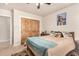 Comfortable bedroom with natural wood closet doors and neutral color walls at 20438 W Carver Rd, Buckeye, AZ 85326