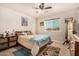 Cozy bedroom with a window and a ceiling fan; rustic decor gives the room character at 20438 W Carver Rd, Buckeye, AZ 85326