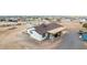 This angle shows a cozy single Gathering home featuring a covered patio and gravel landscaping at 20438 W Carver Rd, Buckeye, AZ 85326