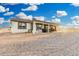 Exterior of home with a large, covered patio featuring ample space for entertaining and relaxation at 20438 W Carver Rd, Buckeye, AZ 85326