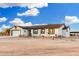 Charming single-story home with desert landscaping and a rustic wooden fence, perfect for country living at 20438 W Carver Rd, Buckeye, AZ 85326