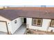 The house's front entrance with a well maintained lawn and nice door at 20438 W Carver Rd, Buckeye, AZ 85326