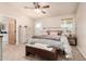 Cozy main bedroom with neutral colors, carpeted floors, and a ceiling fan, creating a relaxing retreat at 20438 W Carver Rd, Buckeye, AZ 85326