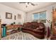 Sitting room with natural light and a comfortable velvet couch at 20438 W Carver Rd, Buckeye, AZ 85326