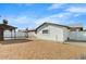 Backyard featuring white walls, a covered patio and shed with low maintenance landscaping at 2053 W Pecan Rd, Phoenix, AZ 85041