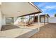 Wide angle view of the home's backyard featuring a patio, a low maintenance yard and covered structure at 2053 W Pecan Rd, Phoenix, AZ 85041