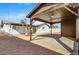 View of the home's backyard with a covered patio area for outdoor relaxation and a low maintenance yard at 2053 W Pecan Rd, Phoenix, AZ 85041