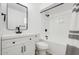 Modern bathroom featuring sleek vanity, updated fixtures, and shower with white and black motif at 2053 W Pecan Rd, Phoenix, AZ 85041