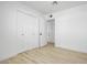 Bedroom with light wood floors and closet at 2053 W Pecan Rd, Phoenix, AZ 85041