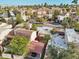 An aerial view shows a neighborhood with townhomes, mature landscaping, and community layout, providing a birds-eye view at 2140 E Rosarita Dr, Tempe, AZ 85281