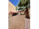 Secluded backyard featuring mature landscaping, decorative rock, and a cozy patio area at 2140 E Rosarita Dr, Tempe, AZ 85281