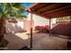 Charming backyard featuring a covered patio area, vibrant plants, and ample space for outdoor enjoyment at 2140 E Rosarita Dr, Tempe, AZ 85281