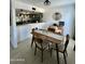 Cozy dining area adjacent to the kitchen, featuring modern decor and tile flooring at 2140 E Rosarita Dr, Tempe, AZ 85281