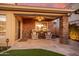 A charming outdoor patio with a brick pillar supporting the roof, creating a cozy space at 21666 N 53Rd Dr, Glendale, AZ 85308