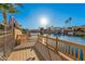 Wooden backyard deck overlooking tranquil waterfront scenery at 21666 N 53Rd Dr, Glendale, AZ 85308