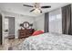 Cozy bedroom with wood-look floors, a dresser, and a comfortable bed at 21666 N 53Rd Dr, Glendale, AZ 85308