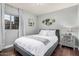 Cozy bedroom with grey walls, one window, and hardwood floors at 21666 N 53Rd Dr, Glendale, AZ 85308