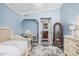 Charming bedroom with blue walls, a crystal chandelier, and a vanity area at 21666 N 53Rd Dr, Glendale, AZ 85308