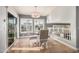 Bright dining area with stylish chandelier, modern chairs, and sliding glass doors for a seamless indoor-outdoor experience at 21666 N 53Rd Dr, Glendale, AZ 85308