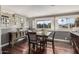 Dining room with hard wood floors, grey walls and windows overlooking the lake at 21666 N 53Rd Dr, Glendale, AZ 85308